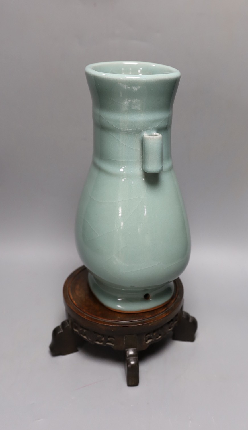 A Chinese celadon glazed arrow vase on a stand 35cm total height